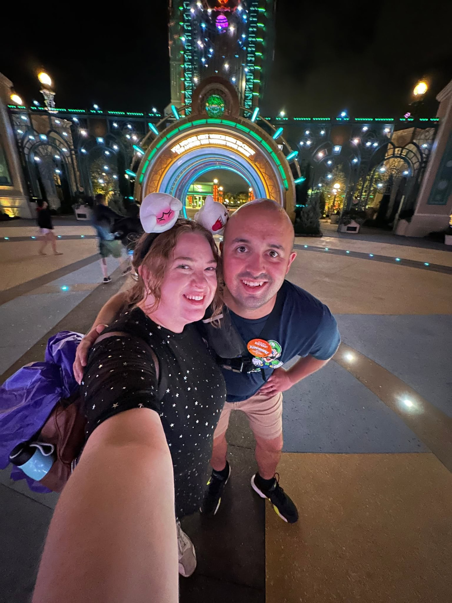 Blake and Josie outside Universal Epic Universe at night